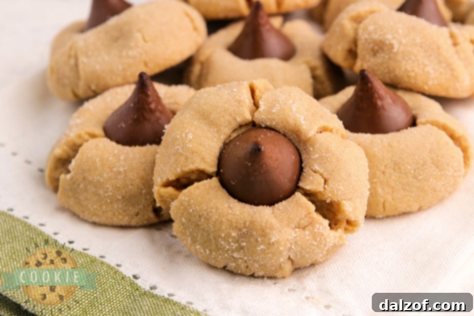 Perfectly baked Cake Mix Peanut Butter Blossom cookies arranged on a cooling rack