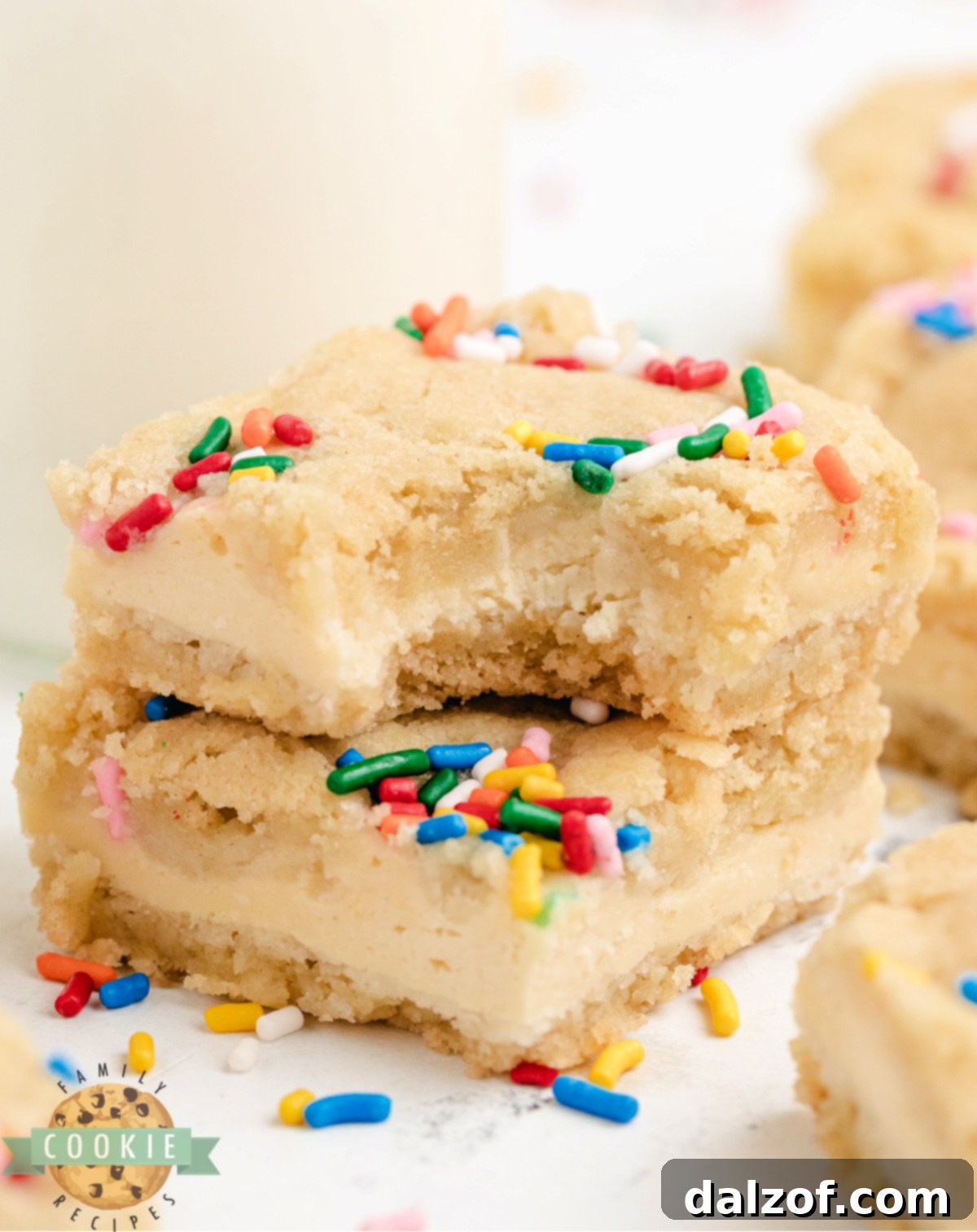 Cheesecake Sugar Cookie Bars are easy to make and delicious to eat! Just 6 ingredients for soft cookie crust and creamy cheesecake center.