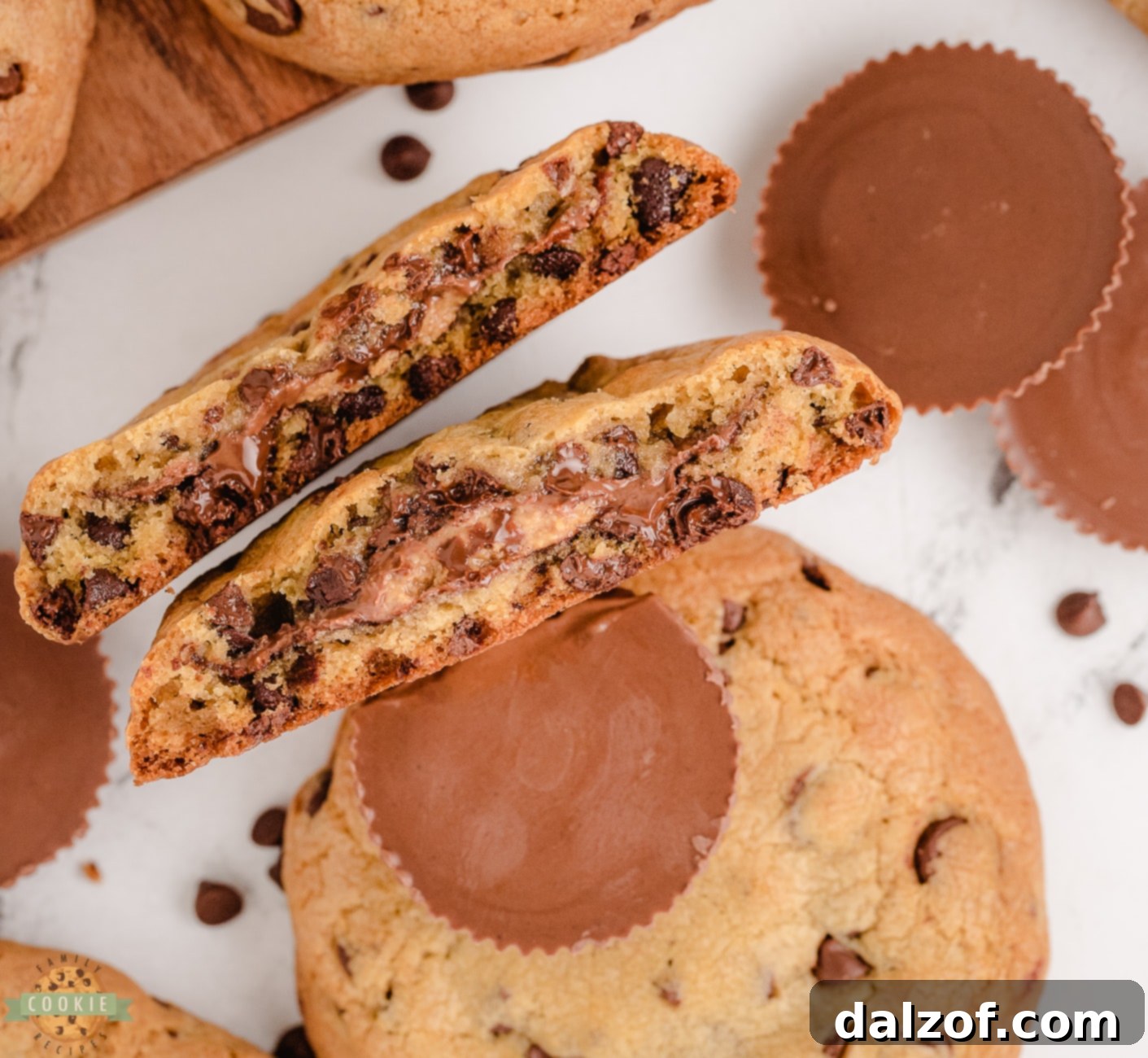 Mouth-watering chocolate chip cookies generously stuffed with creamy Reese's Peanut Butter Cups, showcasing the perfect blend of chocolate and peanut butter in a delightful homemade treat.
