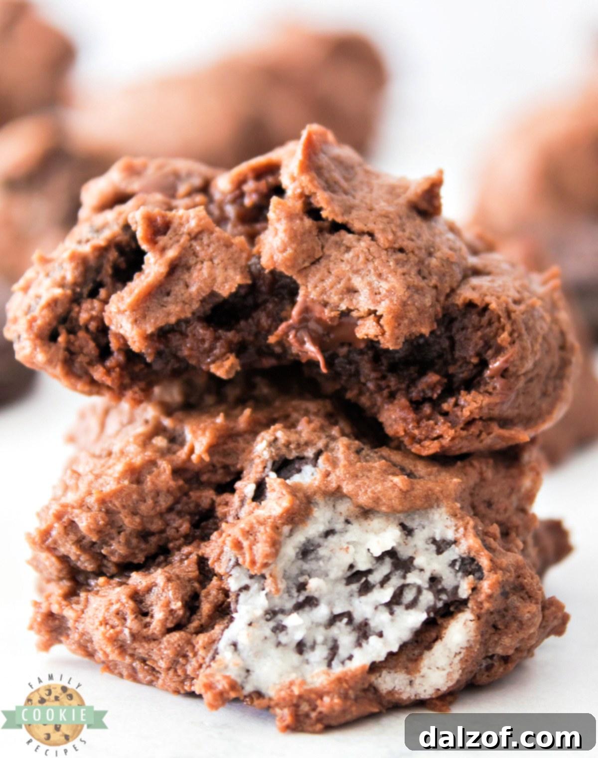 Close-up of a perfectly baked Chocolate Oreo Cheesecake Cookie, showcasing its soft texture and crushed Oreo pieces.