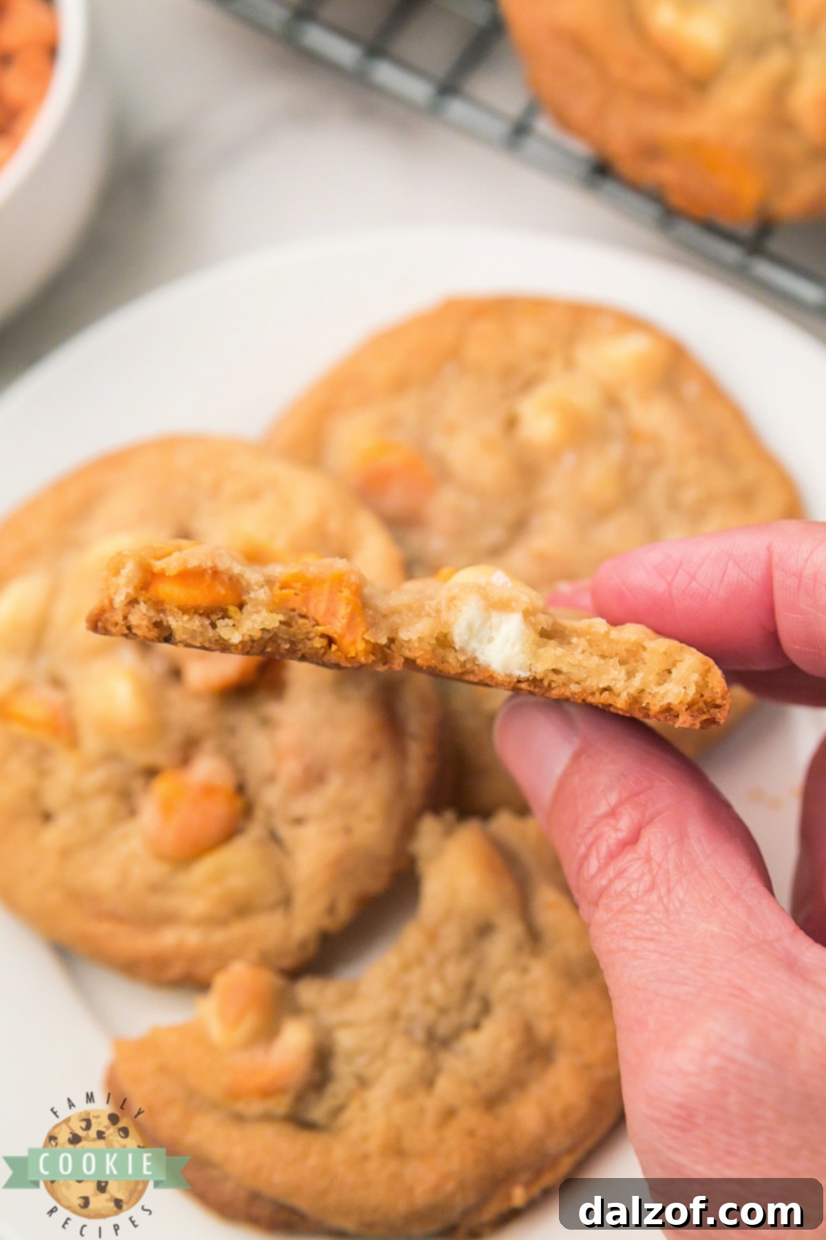 The Ultimate Salted Caramel White Chocolate Chip Cookie 5 The soft, gooey center of a Salted Caramel White Chocolate Chip Cookie, showing melted caramel and white chocolate.