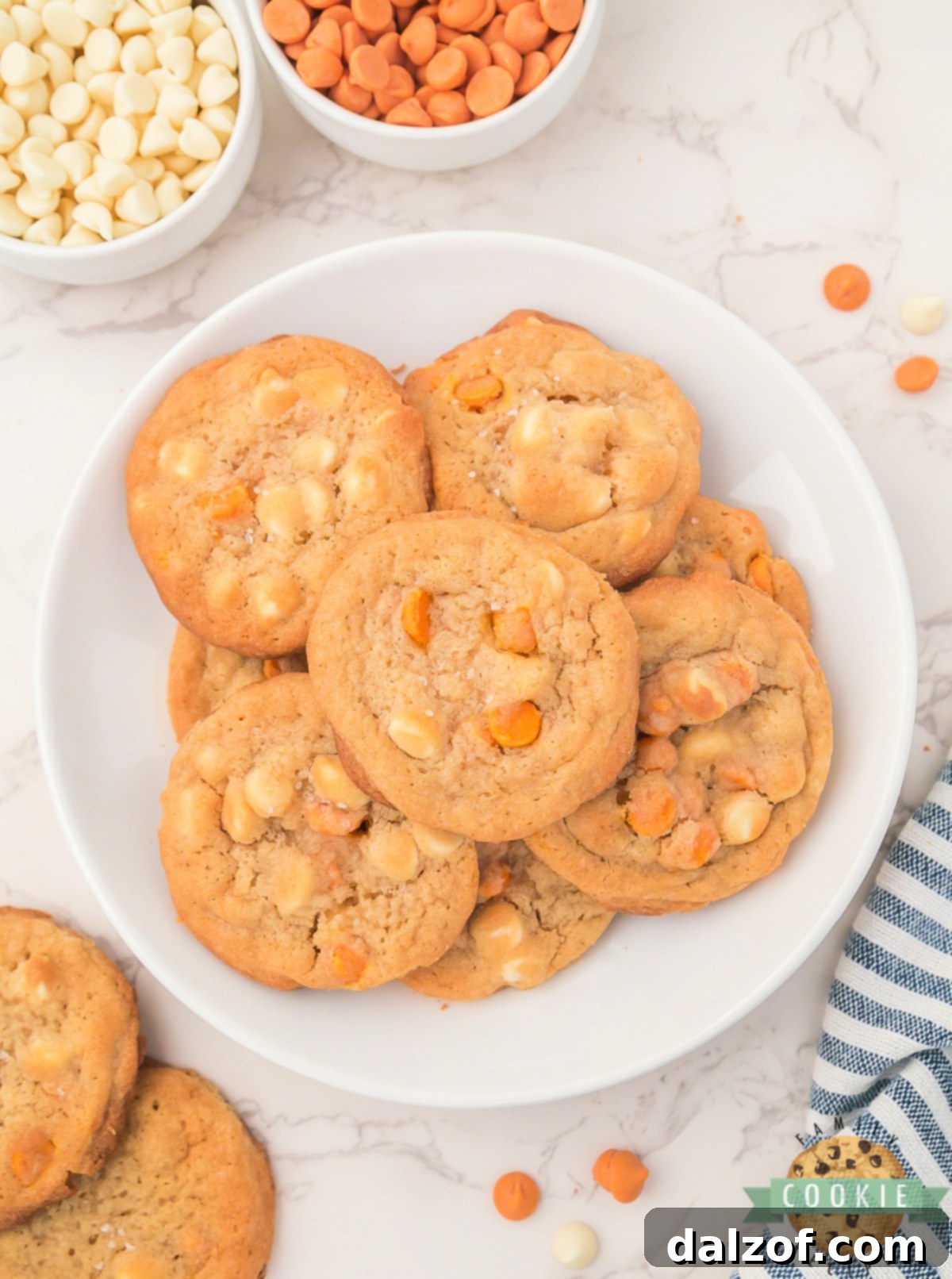 The Ultimate Salted Caramel White Chocolate Chip Cookie 8 A delightful plate of freshly baked Salted Caramel White Chocolate Chip Cookies, showing their golden brown edges and soft centers.