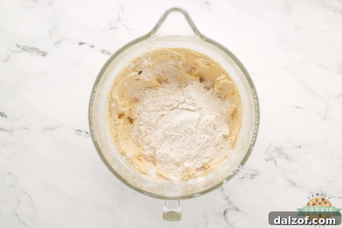 Combining flour, baking soda, and salt before adding to wet mixture.
