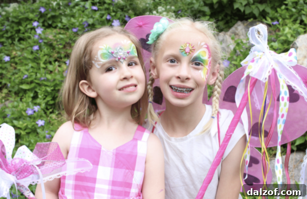 Two young girls smiling at the camera
