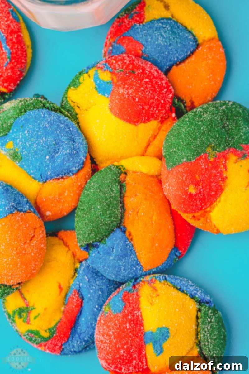 A plate of vibrant, colorful cake mix cookies arranged artfully, showcasing their cheerful hues, ready to be enjoyed.