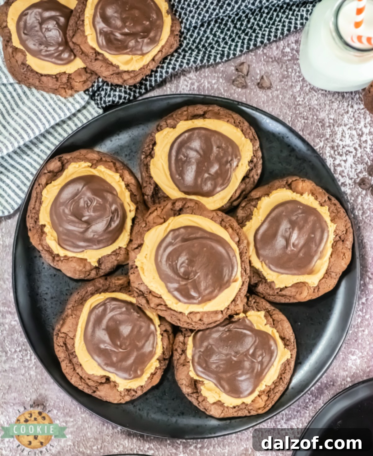 Gourmet Buckeye Brownie Cookies 8 Copycat Crumbl Buckeye Brownie Cookies feature a fudgy chocolate base, creamy peanut butter frosting, and a glossy ganache topping.