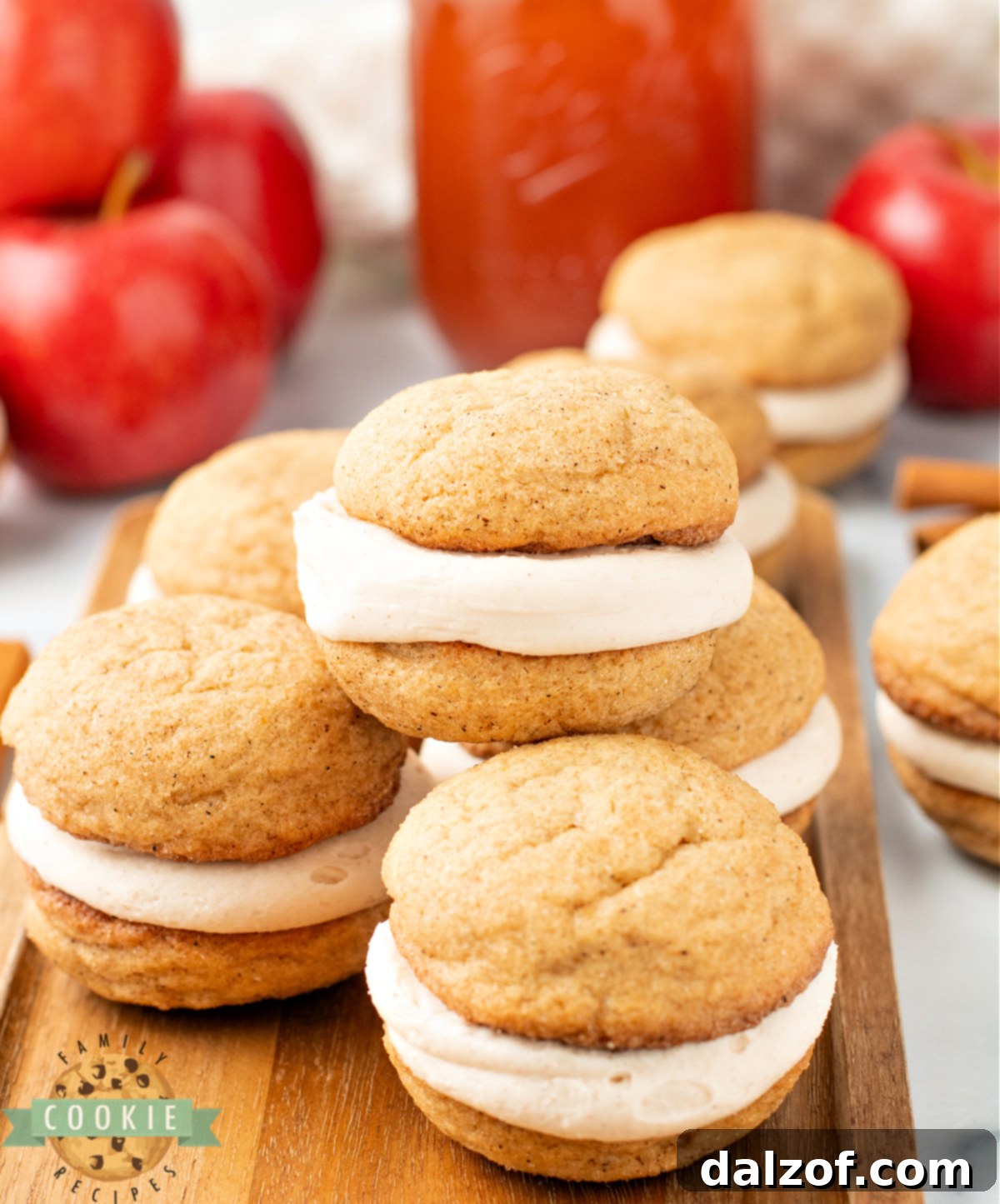 Creamy Apple Cider & Snickerdoodle Delight Pies 3 Stack of soft and chewy apple cider snickerdoodle cream pies showing the frosting layer inside.