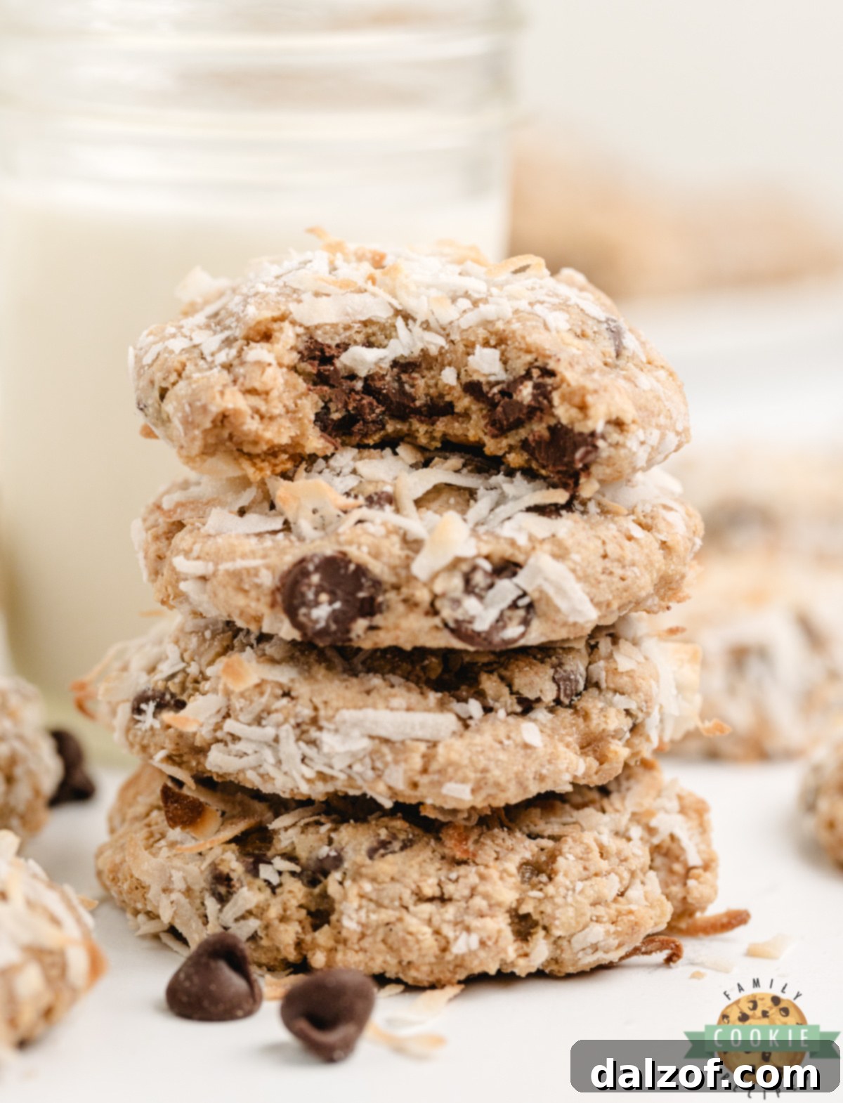 Stack of chewy graham cracker coconut cookies with visible chocolate chips, showcasing the tempting texture of these homemade treats.