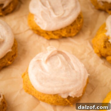 tray of frosted pumpkin cookies