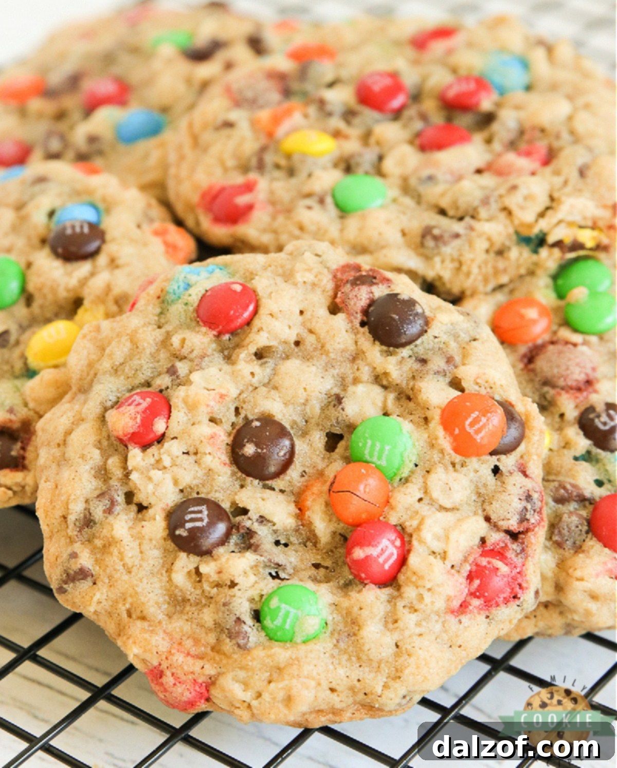 Delicious M&M Oatmeal Cookies on a cooling rack, ready to be enjoyed.
