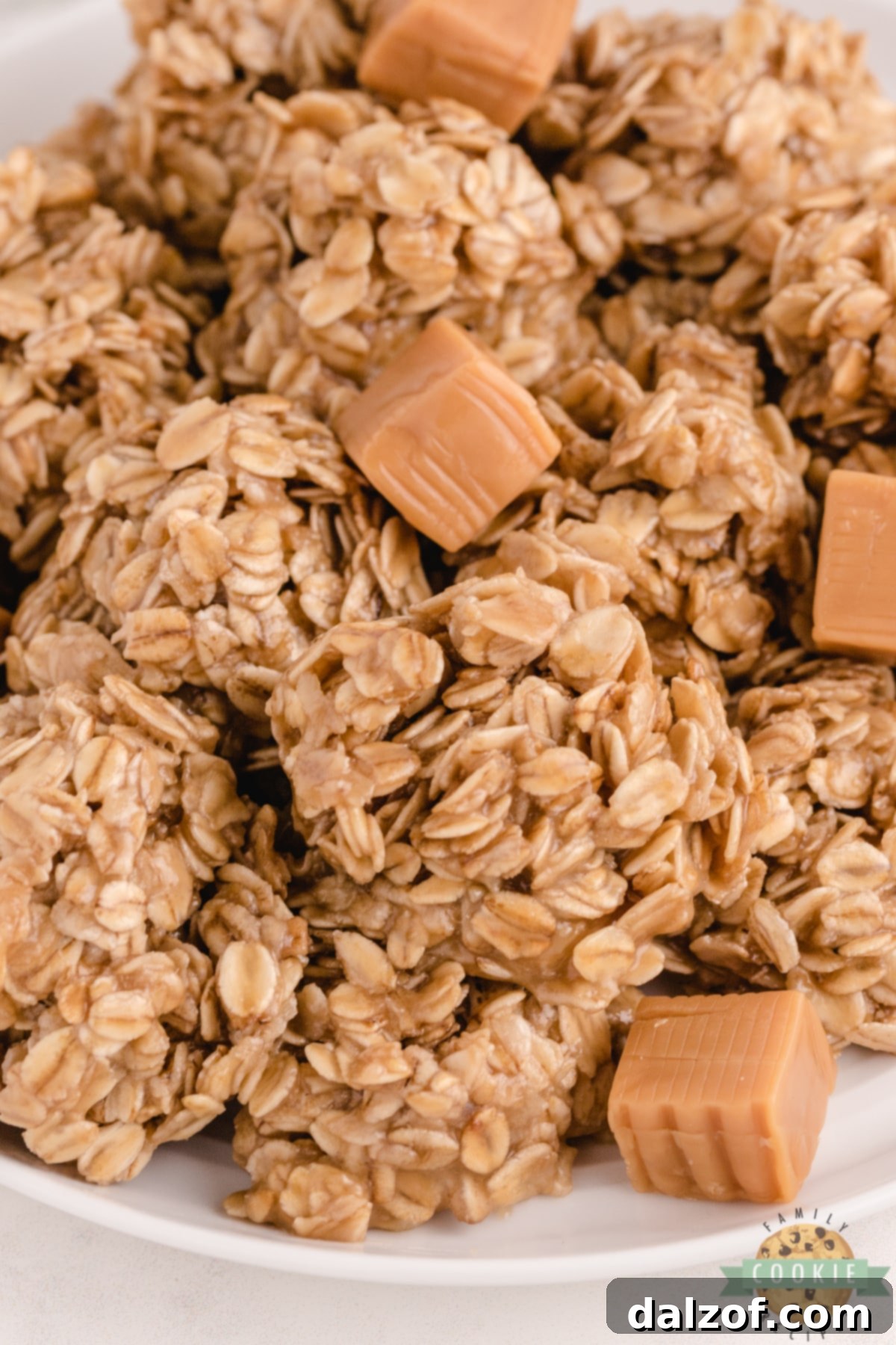 A close-up of freshly made no bake cookies, highlighting the texture of oats and the glossy caramel.