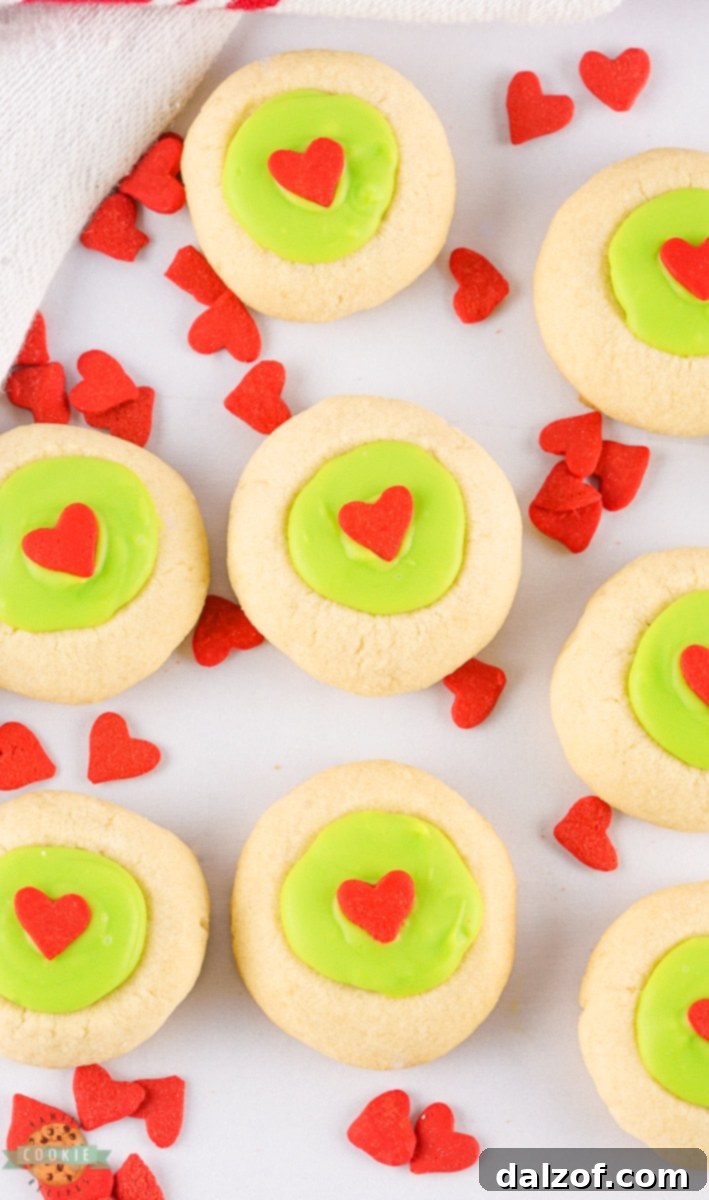 A stack of delicious Grinch Thumbprint Cookies, perfect for holiday gatherings.