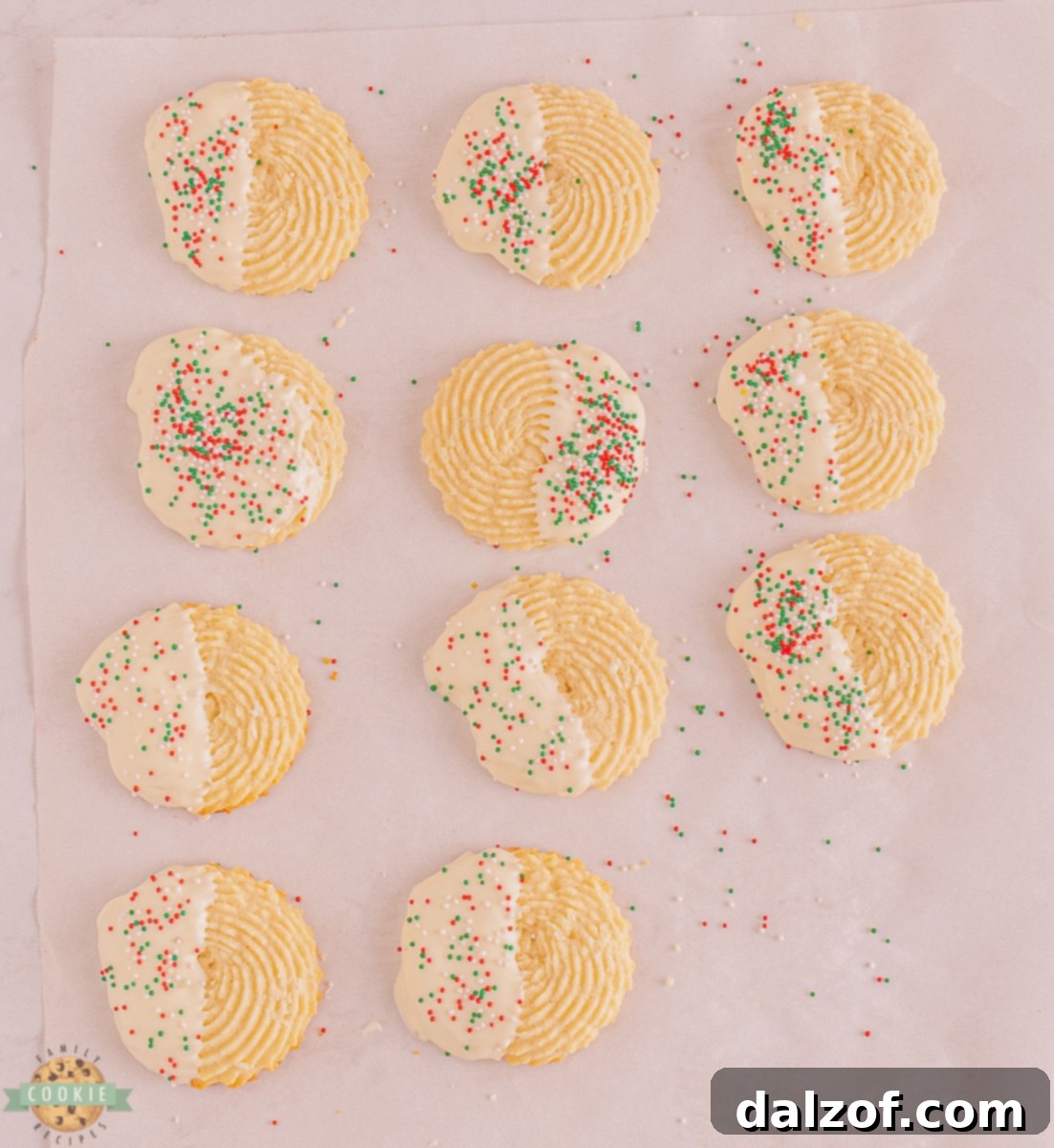 piping butter cookie dough on baking sheet