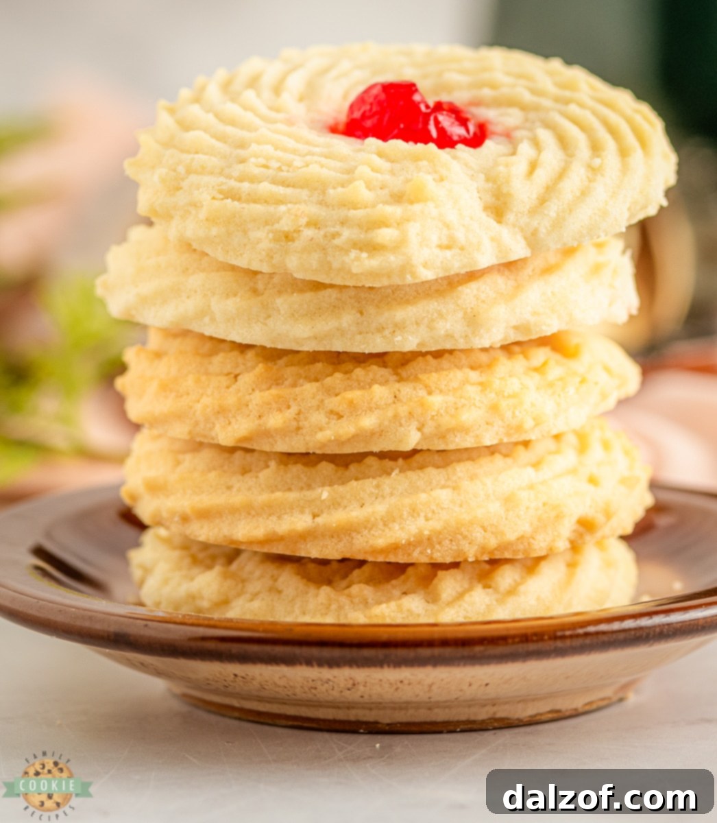 Close-up of freshly baked Cherry Butter Cookies, showing the perfect texture and maraschino cherry center