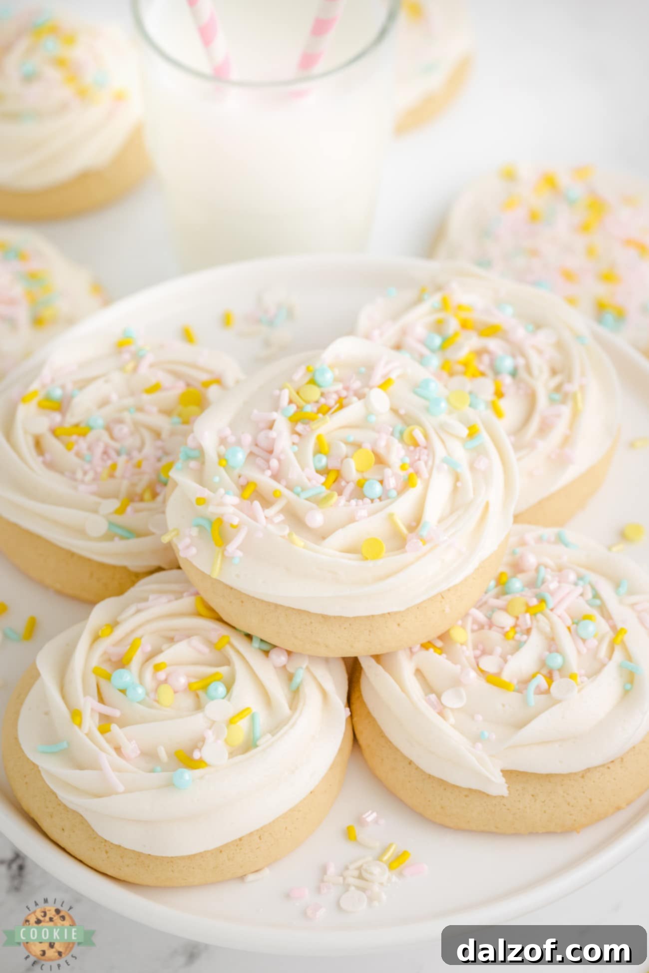 frosted sugar cookies on a plate