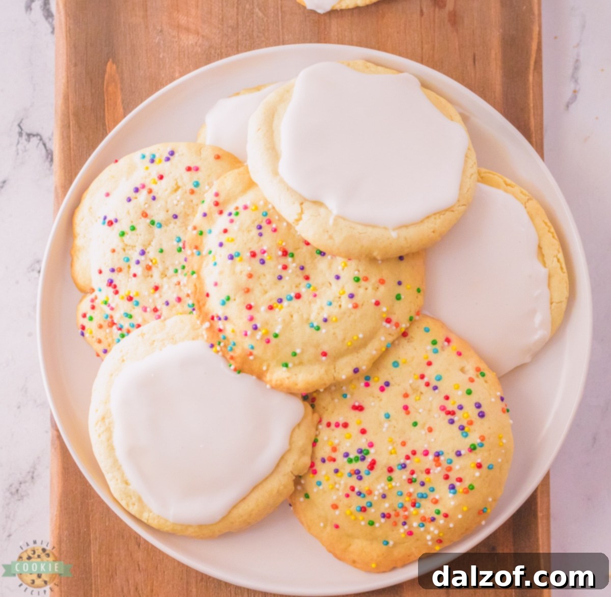 A close-up of crispy sugar cookies on a cooling rack, showcasing their golden edges.