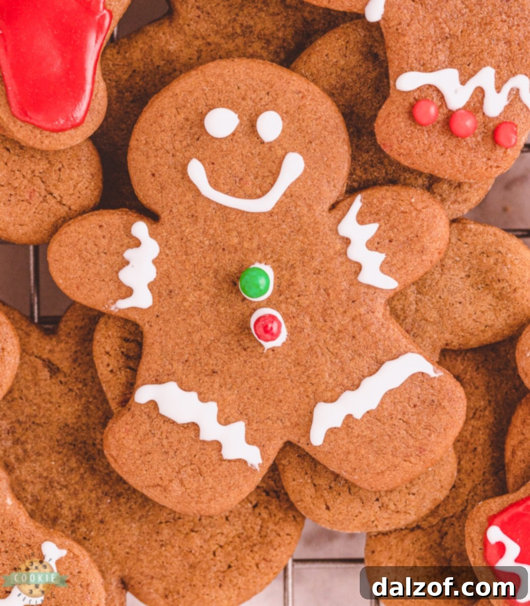 A meticulously decorated gingerbread man cookie, showcasing intricate icing details and festive colors.