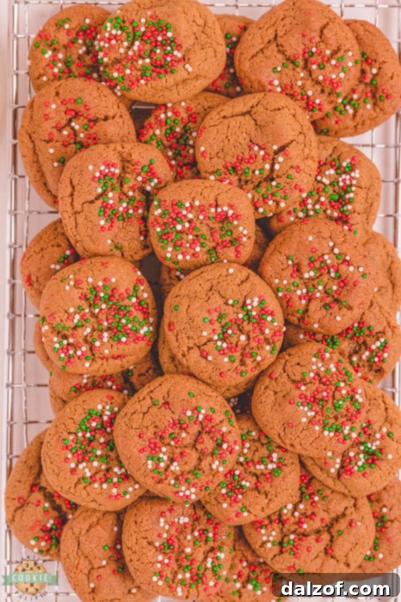 Close-up showing the process of cutting chilled gingerbread dough into small cubes before baking.