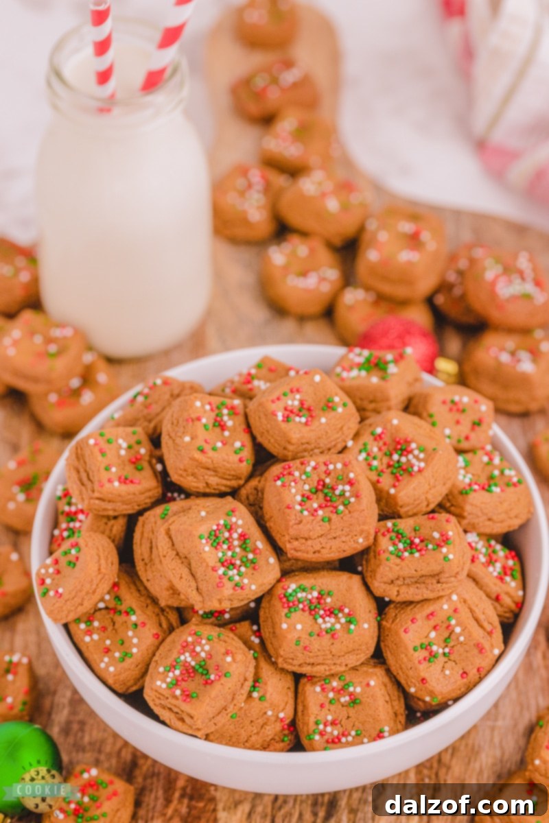 A small stack of baked Christmas Gingerbread Cookie Bites, showing their soft texture and delightful appearance.
