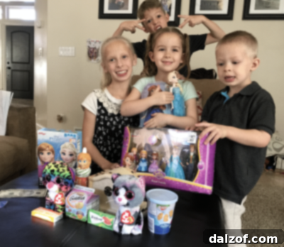 A young girl smiling with birthday presents