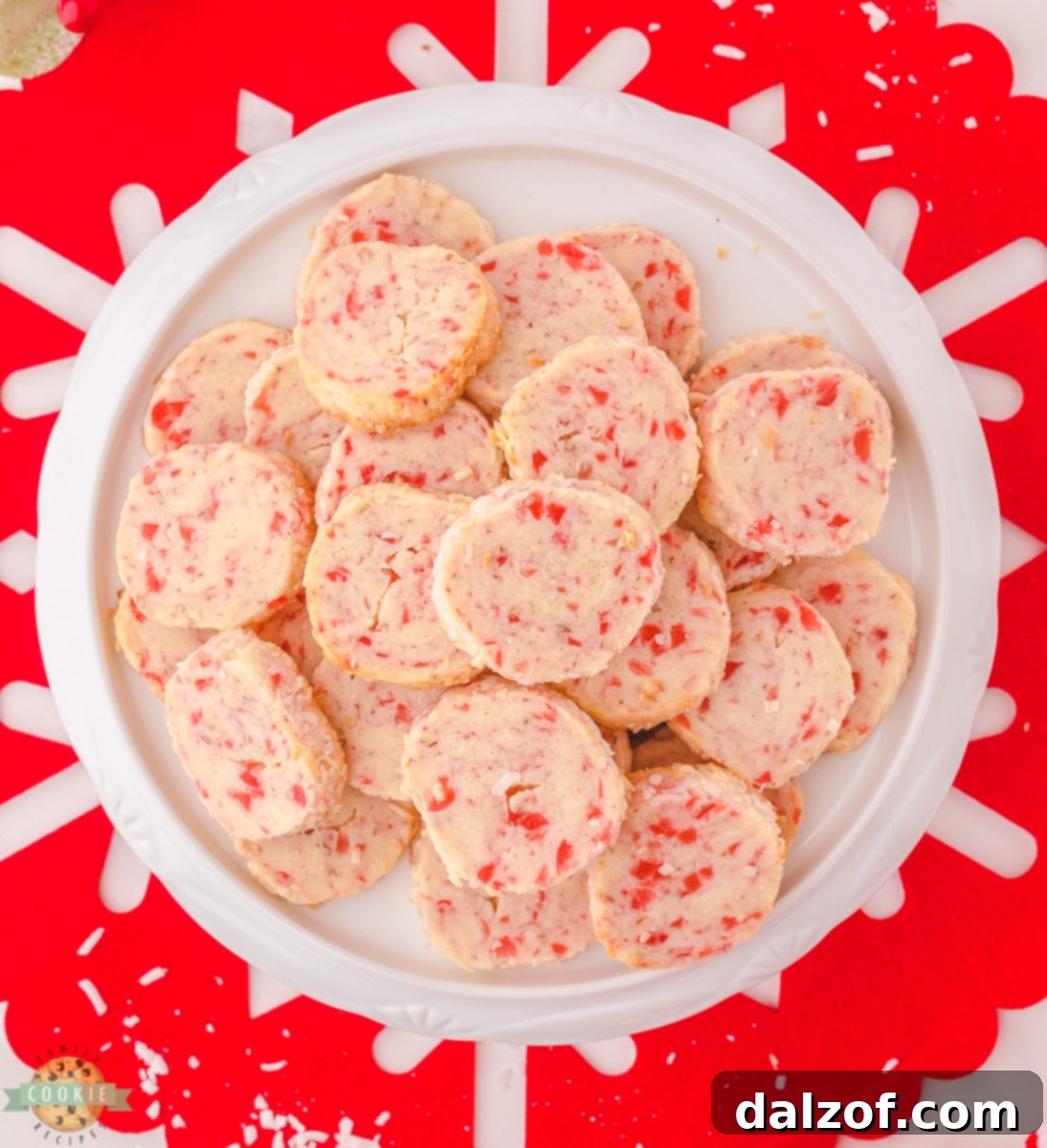 Ingredients for Santa's Whiskers Cookies laid out, including butter, sugar, flour, cherries, pecans, and coconut.