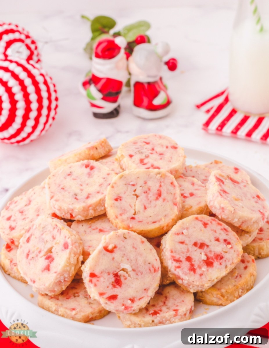 Santa's Whiskers cookie dough logs rolled in shredded coconut, ready for chilling.