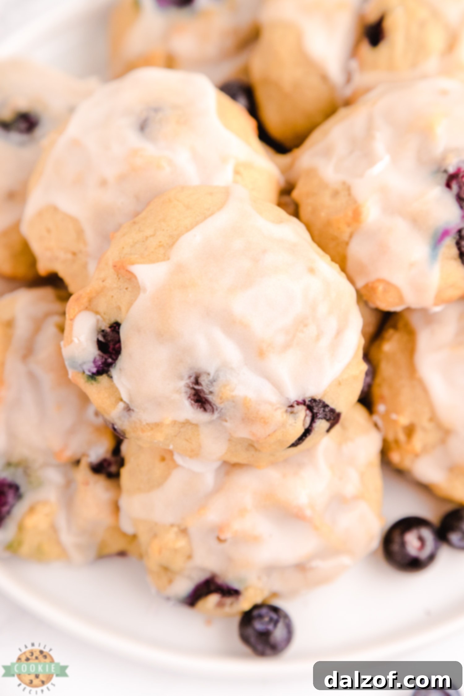iced blueberry banana cookies arranged artfully on a plate