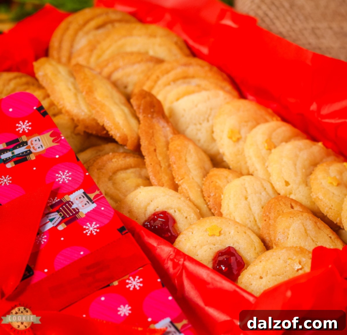 Classic Danish butter cookies on a cooling rack, showcasing their golden-brown edges and intricate piped shapes, ready to be enjoyed.