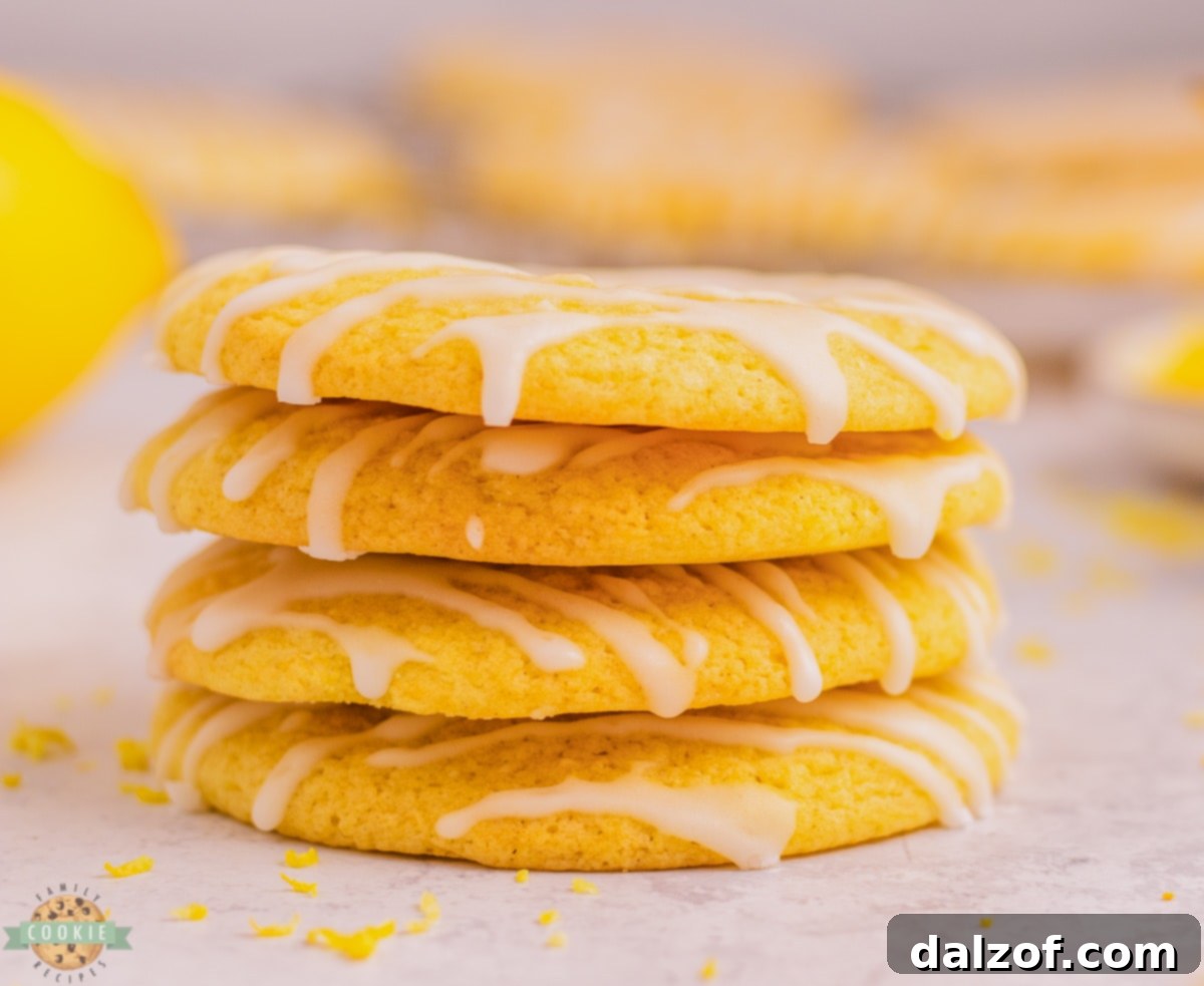Fresh lemons and baking ingredients for making delicious soft glazed lemon cookies.