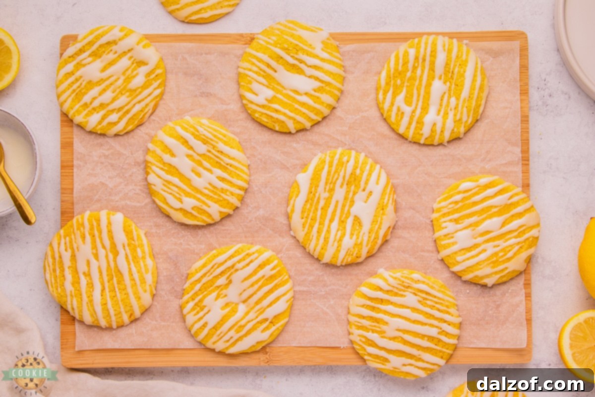 Stack of soft glazed lemon cookies, showcasing their inviting texture.