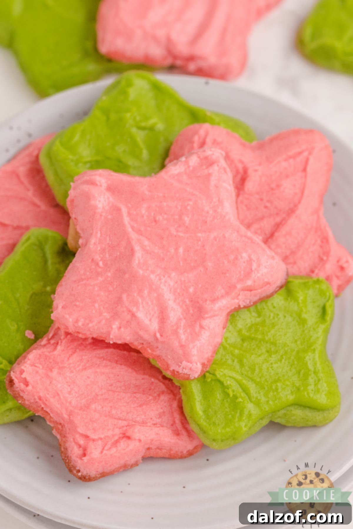 Christmas Jello Sugar Cookies made with red and green Jello in the cookies and the frosting. Festive and flavorful cut-out sugar cookies that can be made with any flavor of Jello! 