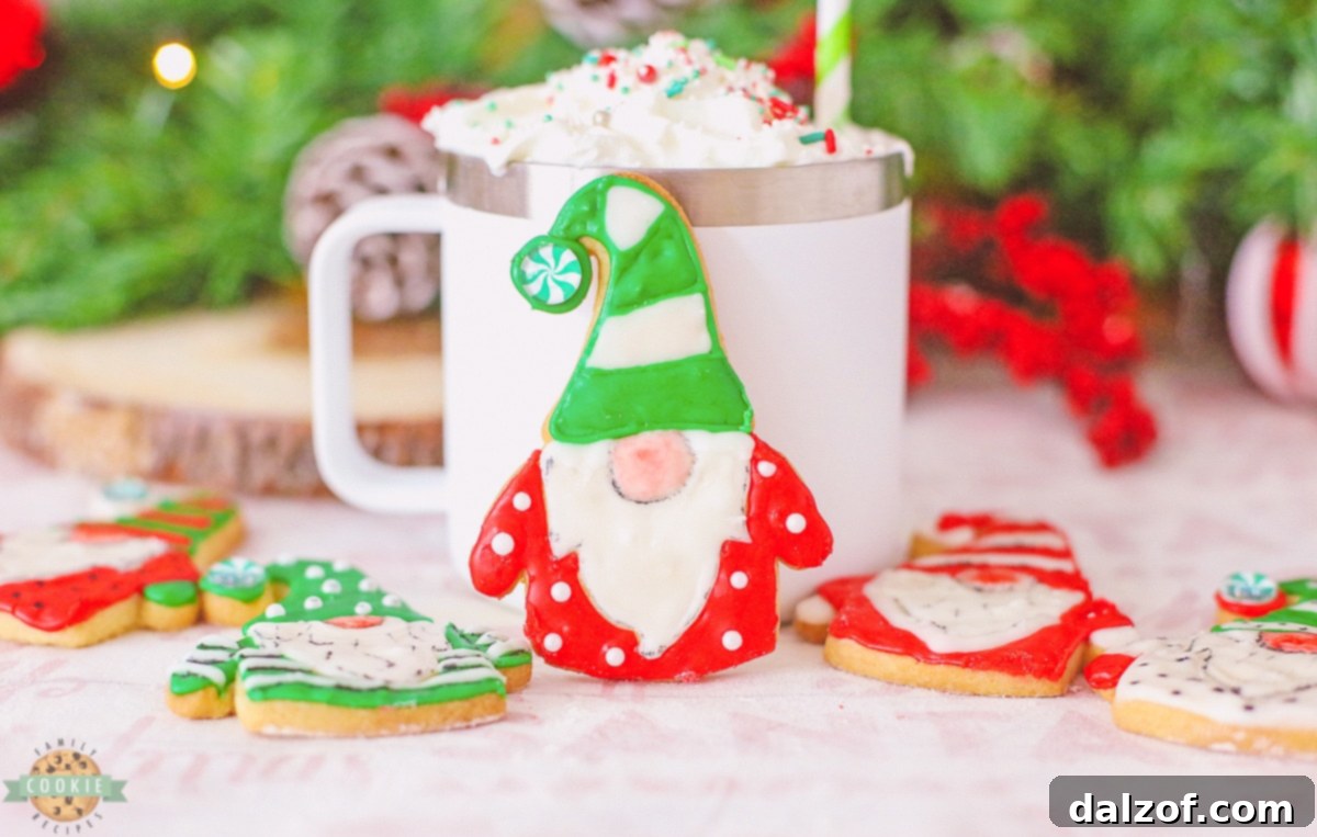 a collection of festive iced gnome cookies featuring red hats, green shirts, and white beards, some with candy decorations.