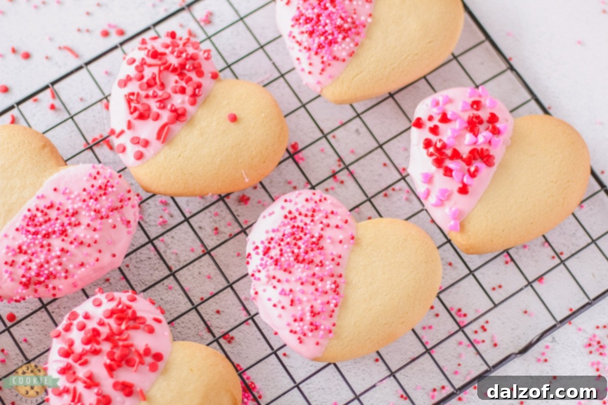 Delicious Valentine Heart Cookies dipped in chocolate and decorated with sprinkles