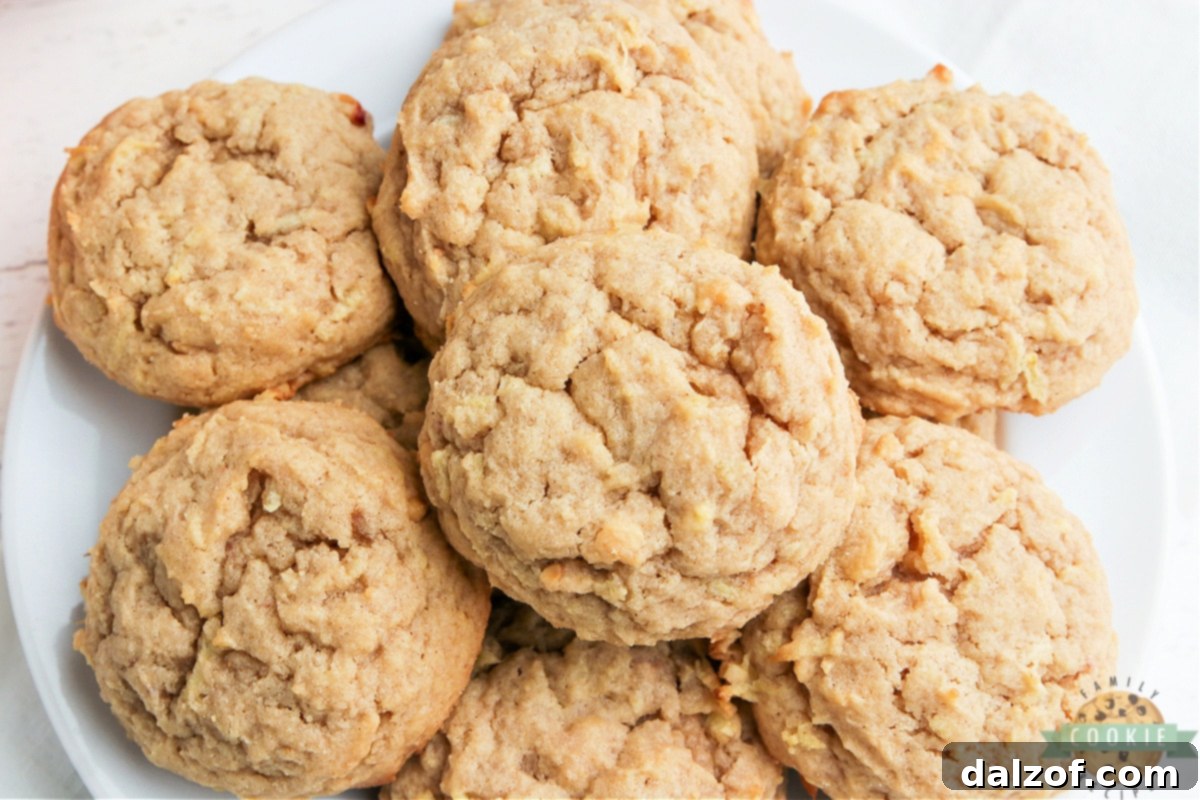 Close-up of peanut butter cookies with fresh grated apples and a sprinkle of cinnamon.
