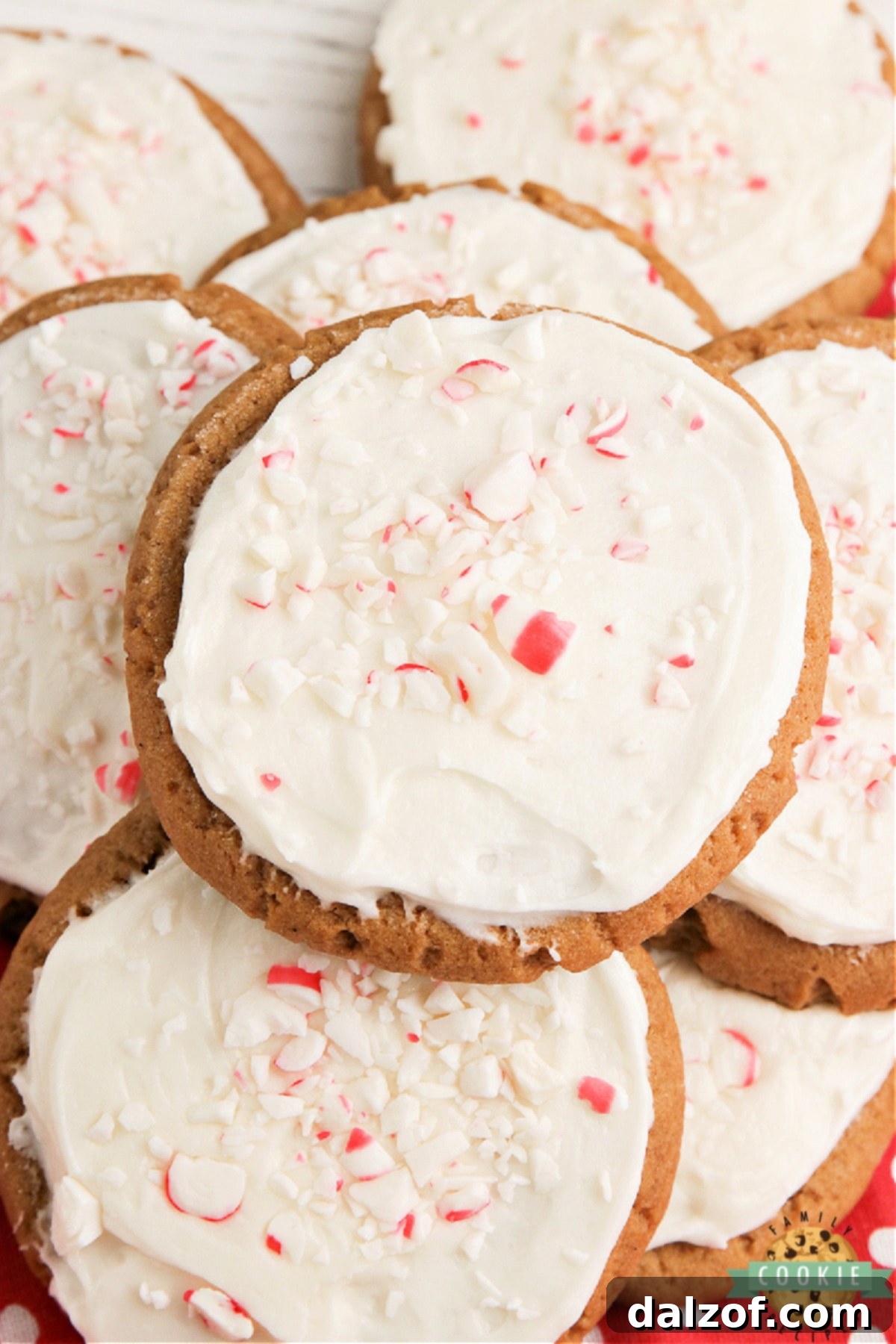 A stack of frosted gingerbread cookies, showcasing their soft texture