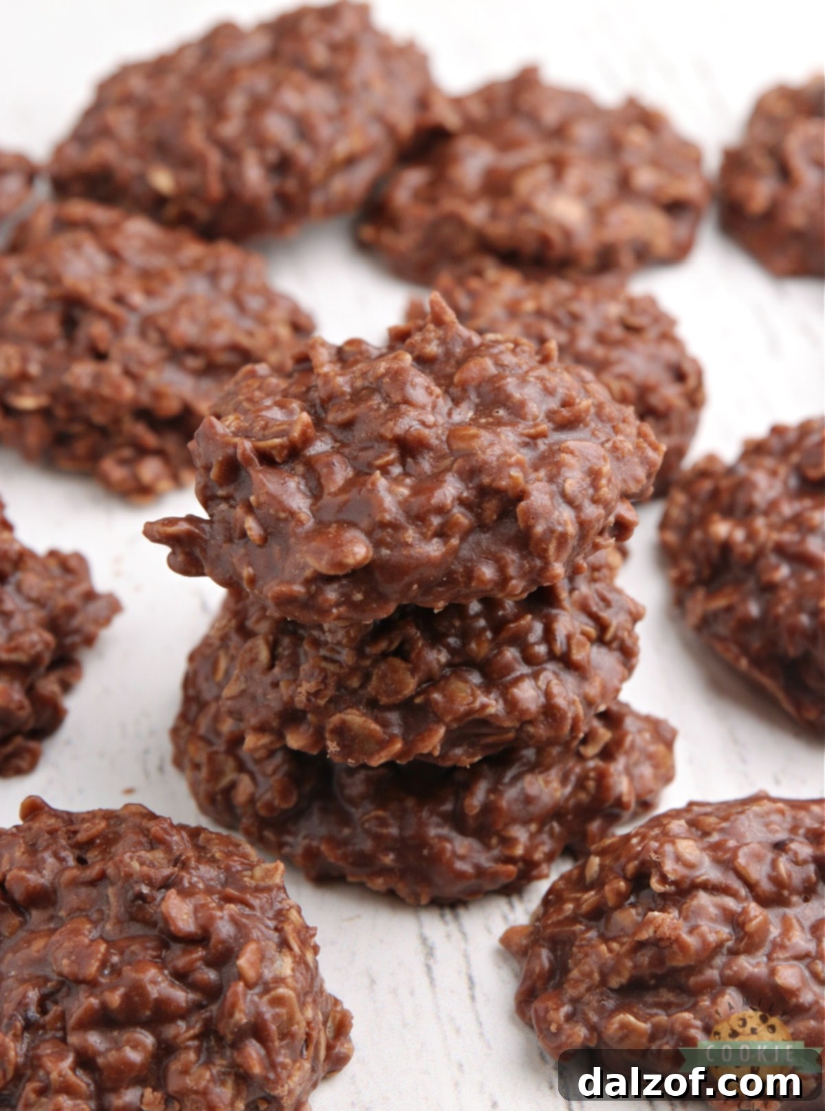 A delicious batch of Nutella No Bake Cookies cooling on wax paper, ready to be enjoyed.