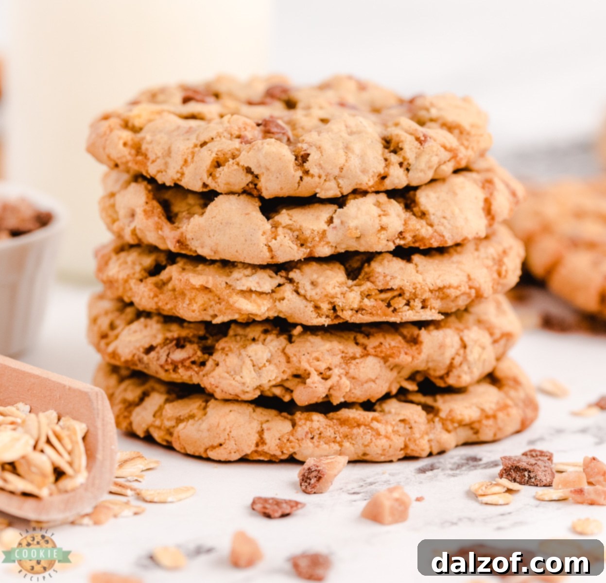 stack of oatmeal toffee cookies on a white plate
