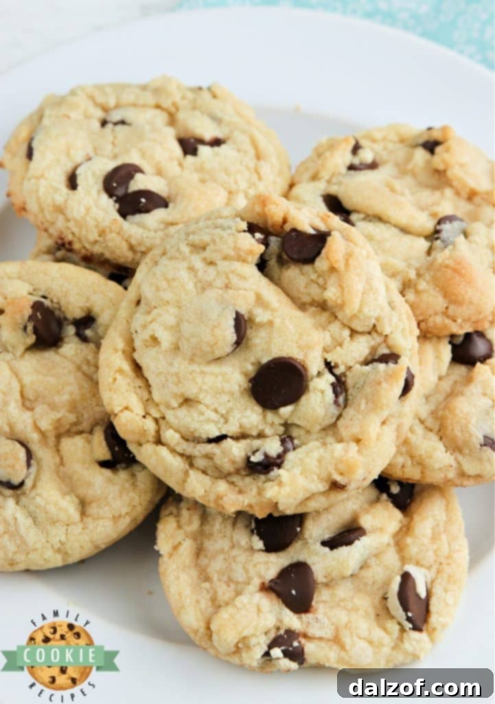 A stack of perfectly baked soft and chewy chocolate chip cookies.