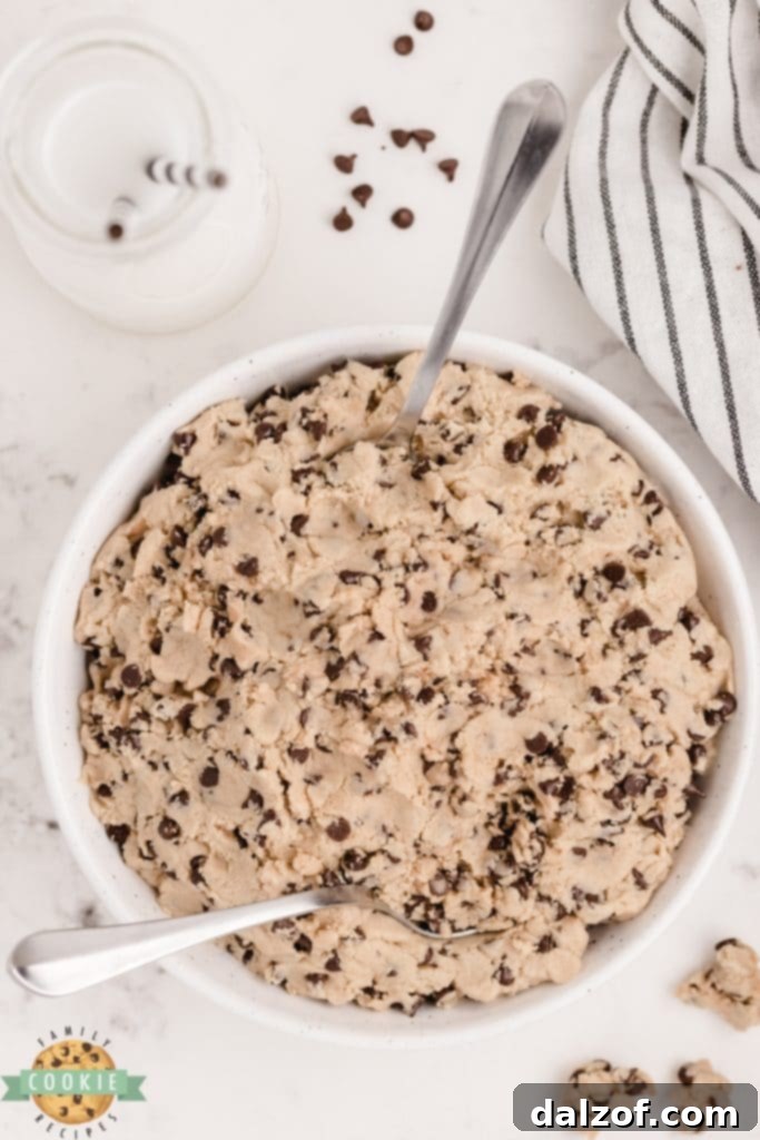 A scoop of edible chocolate chip cookie dough in a bowl.