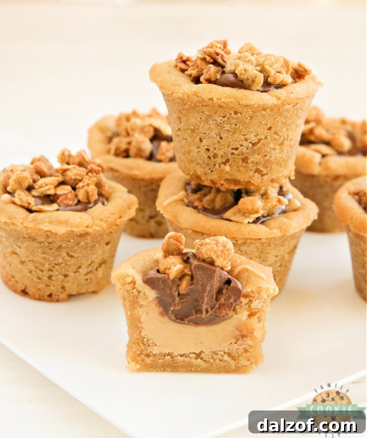 Close-up of Chocolate Peanut Butter Cookie Cups with creamy filling and granola