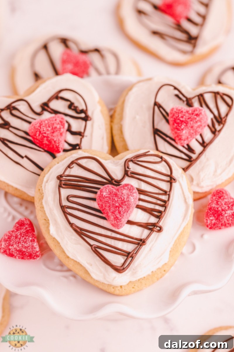 Close-up of Chocolate Heart Valentine's Sugar Cookies arranged artfully, highlighting their soft texture and elegant decoration.