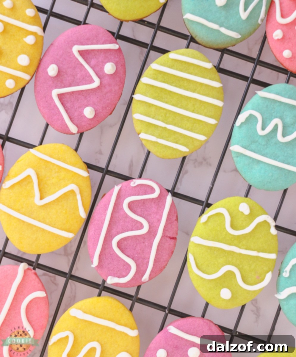 Freshly baked Easter Egg Sugar Cookies cooling on a rack