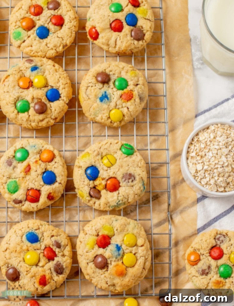 Close-up of baked oatmeal cookies with colorful M&M candies, showcasing their chewy texture.