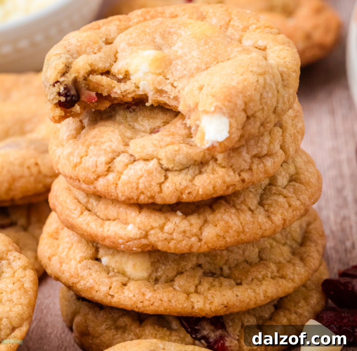 Stack of buttery white chocolate cookies with cranberries