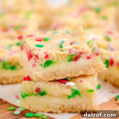 sugar cookie bars with a cheesecake filling