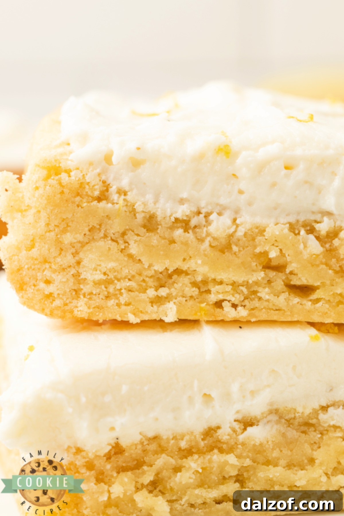 Soft and chewy lemon cookie bars with cream cheese frosting.