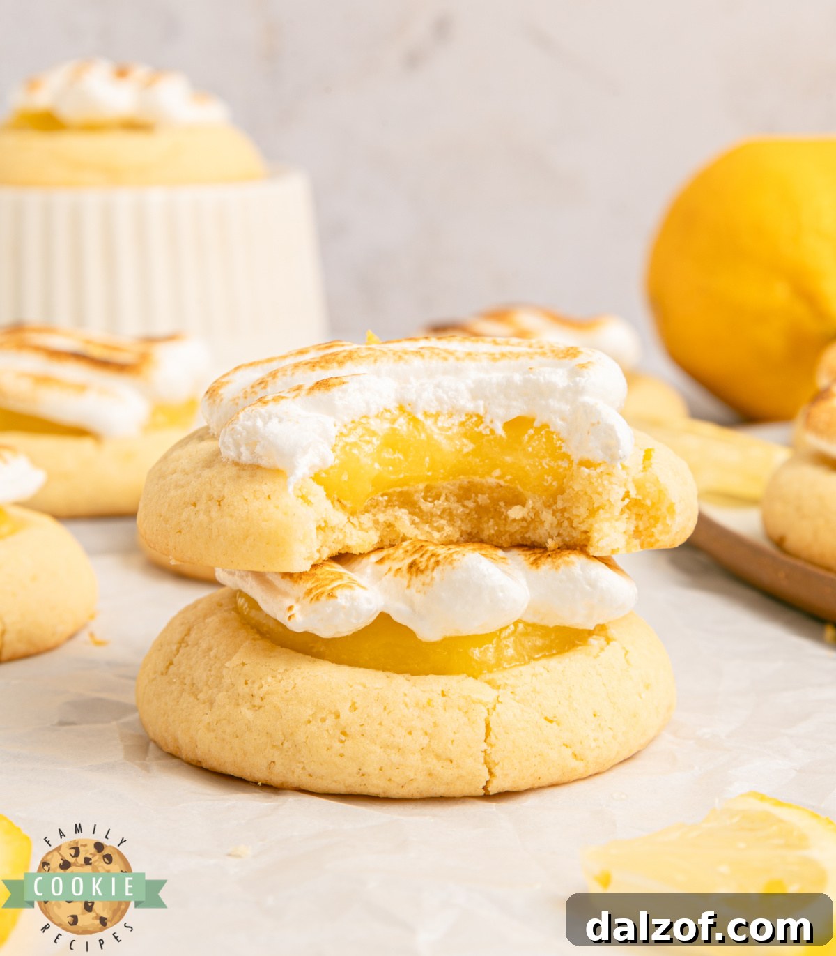 Lemon meringue pie cookie cut in half showing curd filling.