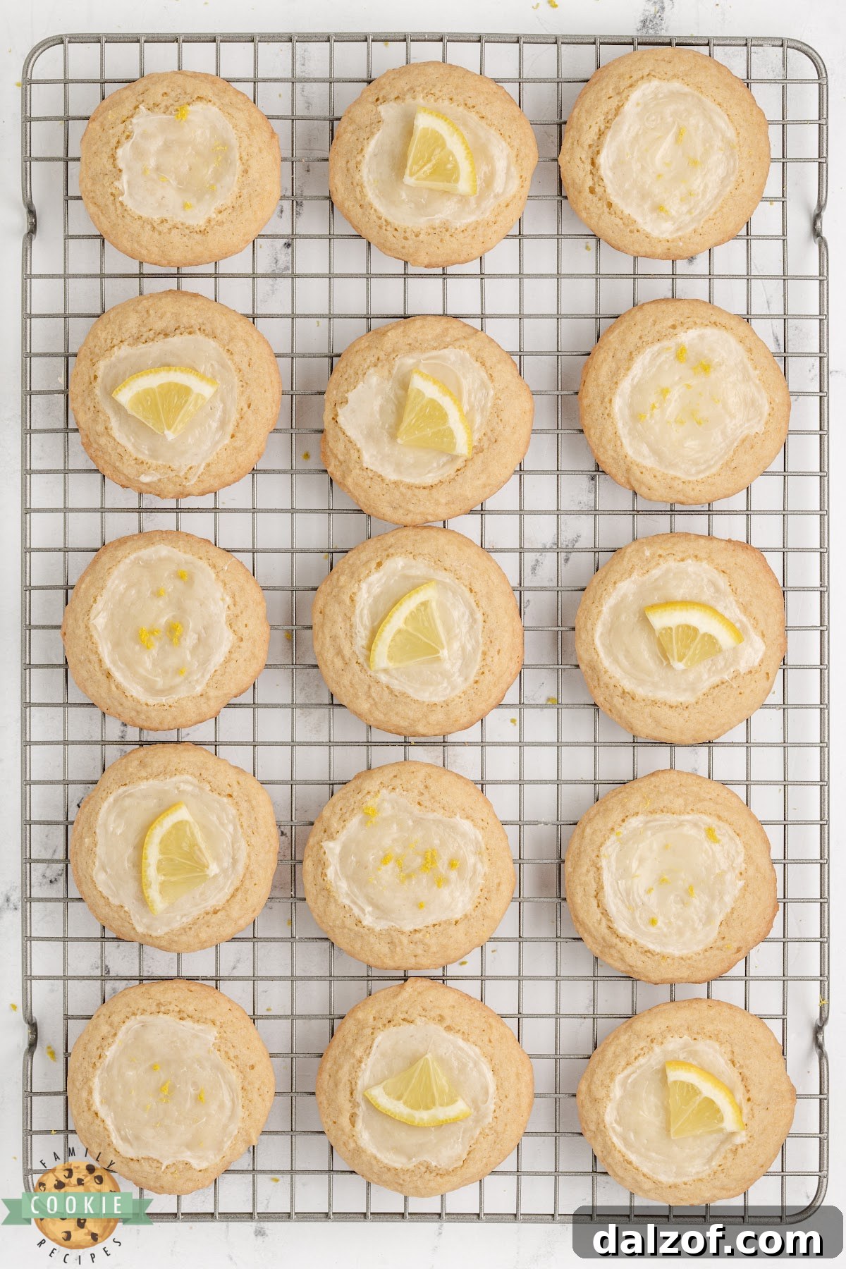 Lemon cheesecake cookies cooling on a wire rack 